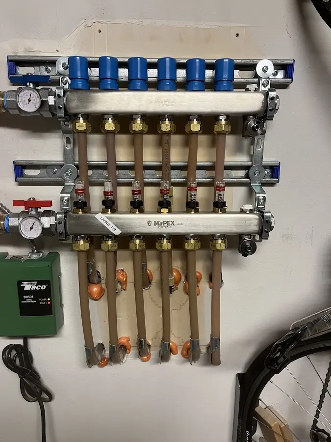 Plumber performing Water Heater Repair at a residential property in Loudon